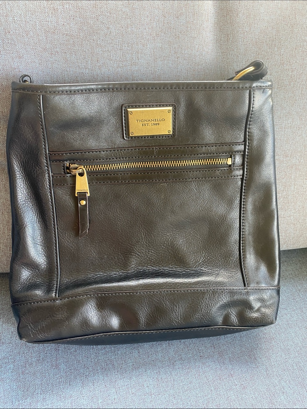 Tignanello Black Leather Messenger Bag with Gold Hardware
